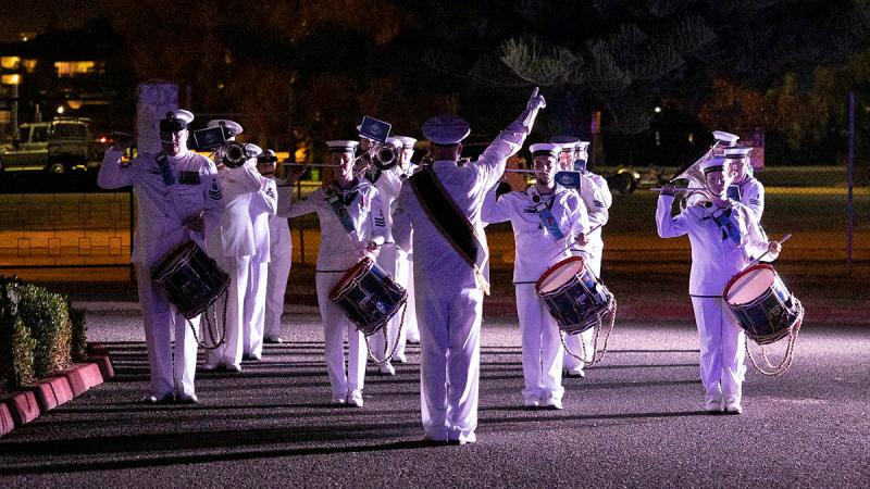 Members of the Royal Australian Navy Band - WA prepare to retire from the ceremonial sunset in celebration of Navy Week at Leeuwin Barracks, WA. Photo: Leading Seaman Julia Rickards