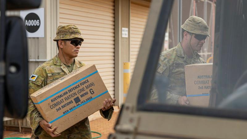 Corporals Dorn Nguyen and William Beddoes load rations in Broome during Operation Flood Assist 23-1. Photo: Leading Seaman Jarrod Mulvihill