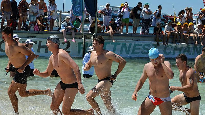 Soldiers and officers from 16th Battalion, The Royal Western Australia Regiment and 10th Light Horse Regiment run to shore during the Rottnest Channel Swim. Photos: Lieutenant Colonel Lachlan Bromley