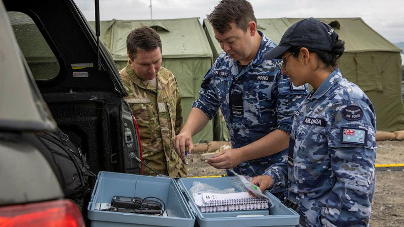 Australian and New Zealand environmental health team (L-R) Lieutenant Christopher Buerkeman, Flight Lieutenant Michael Hong and Flying Officer Kimi Ahluwalia assess potability of local drinking water in support of the local council of Napier, New Zealand.