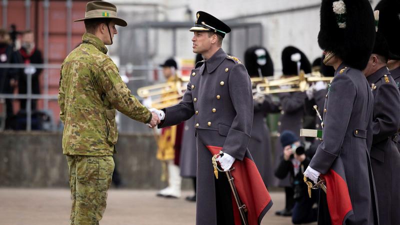 Prince William presents a leek to a soldier from the 5th Battalion, Royal Australian Regiment, during St David's Day celebrations in Windsor, UK. Photos: Corporal Jonathan Goedhart