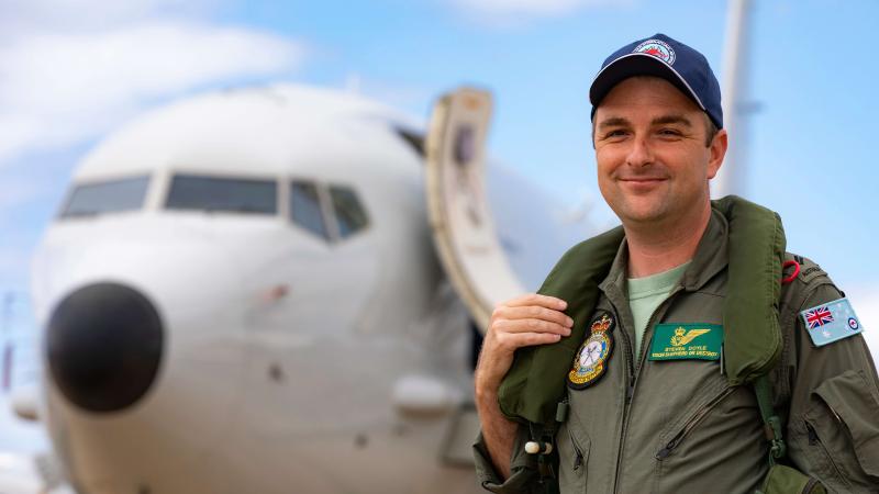 Royal Australian Air Force airborne electronics analyst Corporal Steven Doyle displays the P-8A Poseidon while at the Australian International Airshow, Avalon, Victoria.