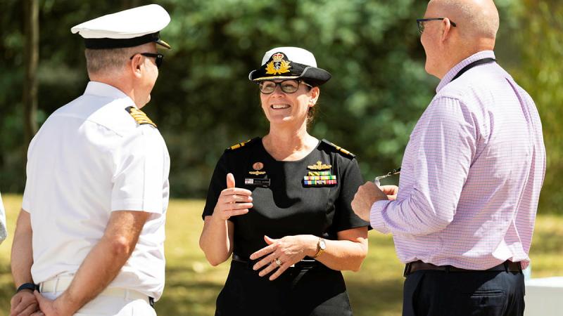 Incoming Head of Navy Engineering Rear Admiral Rachel Durbin speaks with colleagues at a transfer of authority ceremony at Campbell Park in Canberra. Photo: Petty Officer Jake Badior