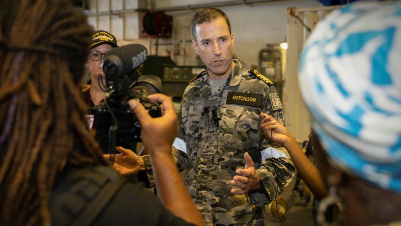 Commanding Officer HMAS Canberra Captain Jace Hutchison speaks with Vanuatu media on board HMAS Canberra during Operation Vanuatu Assist. Photo: Leading Seaman Matthew Lyall