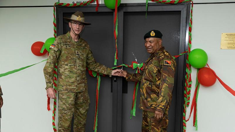 Australia's Chief of Defence Force General Angus Campbell, left, and the Commander of the Papua New Guinea Defence Force Major General Mark Goina, cut the ribbon to refurbished soldiers accommodation at Taurama Barracks, Papua New Guinea. Photo: Corporal Brandon Grey