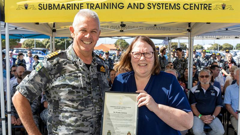 Director Training Authority - Submarines Captain Richard Lindsey presents a certificate of appreciation to Wendy Jackson for 30 years of service at the Submarine Training and Systems Centre at HMAS Stirling. Photos: Chief Petty Officer Yuri Ramsey