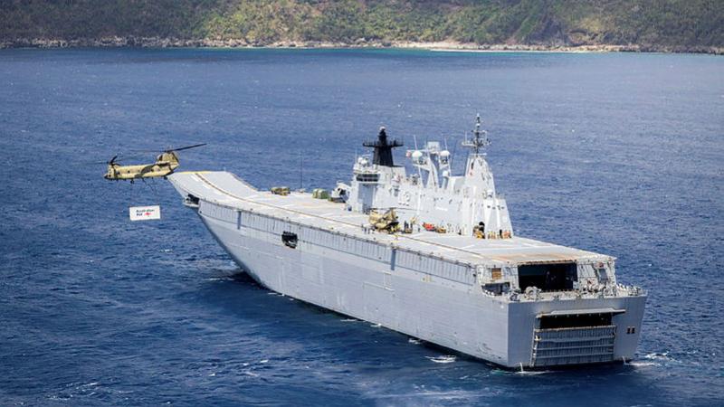 An Australian Army CH-47 Chinook takes off from HMAS Canberra near the coast of Futuna Island to conduct a vertical replenishment. Photo: Leading Seaman Matthew Lyall