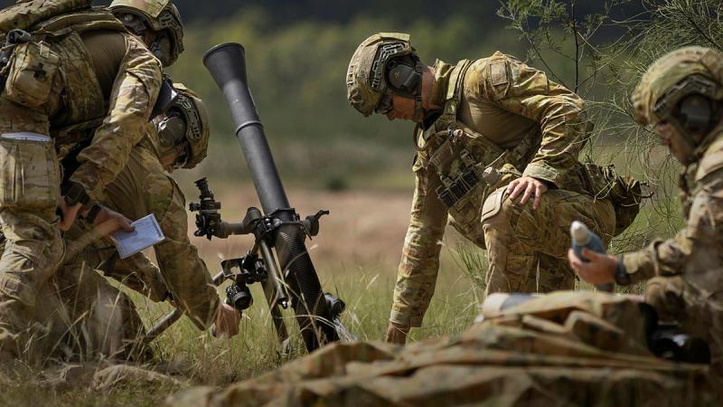 Army soldiers from 9th Regiment, Royal Australian Artillery prepare to fire an 81mm mortar during Exercise Waratah Run in Singleton. Photos: Corporal Jacob Joseph