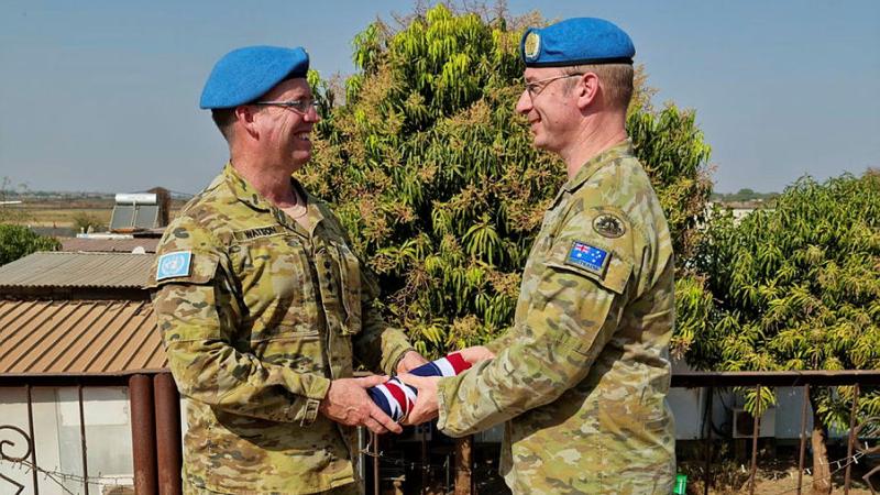 Outgoing Commander of the Australian Contingent, Colonel Richard Watson, left, hands over command to Colonel David Hughes on February 18, 2023. Photos: Flight Lieutenant Aminta Thomas