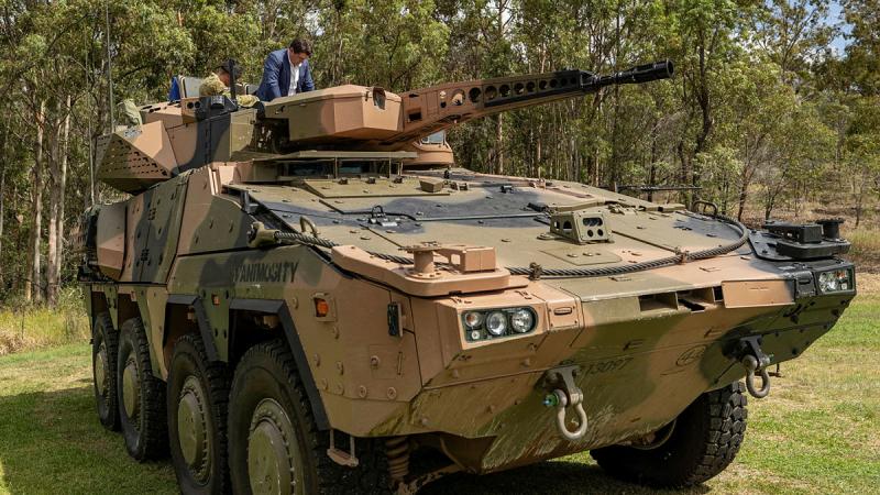 Germany Parliamentary State Secretary for Defence Thomas Hitschler has a close look at an ADF Boxer combat reconnaissance vehicle at Gallipoli Barracks in Brisbane. Photo: Signaller Christopher Kingston