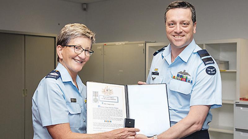 Commander Air Warfare Centre Air Commodore Adrian Maso presenting Warrant Officer Janet Brennan with her Federation Star. Photo: Leading Aircraftwoman Annika Smit