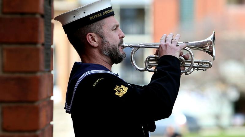 Then Leading Seaman Marcus Salone plays the Last Post during a memorial service held on completion of the Freedom of Entry at the Bathurst War Memorial in 2016. Photo: Leading Seaman Nicolas Gonzalez