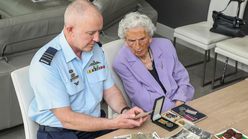 Wing Commander Adam Robinson with 100 year old Dorothy Craig who is the surviving spouse of decorated RAAF WW2 veteran Lloyd Craig who died in 1962. Photo: Corporal Brenton Kwaterski