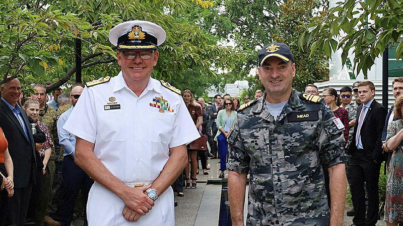 Chief Nuclear Powered Submarine Task Force Vice Admiral Jonathan Mead, right, presents a Federation Star to Commodore Guy Holthouse, left, at Navy/Army birthday morning tea at Brindabella Park. Photo: Scott Bolitho