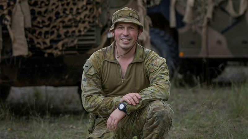 Lance Corporal Matthew Troup, from 1st/15th Royal NSW Lancers B Squadron, in front of a Bushmaster protected mobility vehicle during Exercise Waratah Run. Photo: Corporal Jacob Joseph