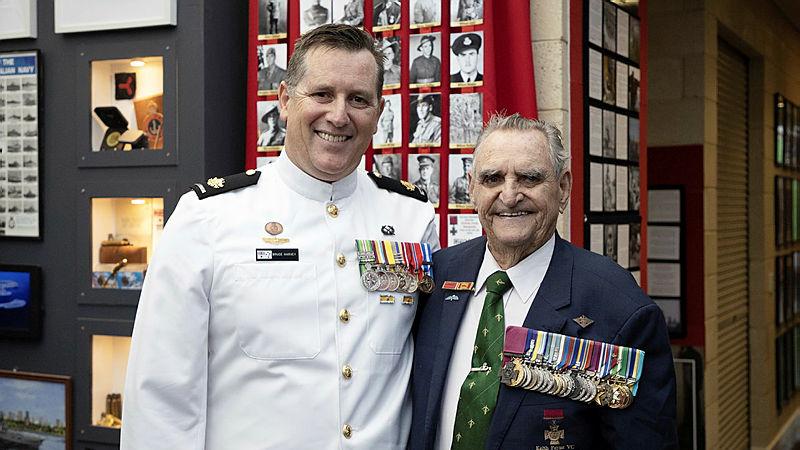 Warrant Officer Bruce Harvey, left, and Mr Keith Payne stand in the Military Museum at Comet Bay College in Secret Harbour, WA. 