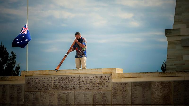Navy Regional Indigenous Development Coordinator Leading Seaman Joseph Canning plays the didgeridoo during rehearsals on the Gallipoli peninsula in Türkiye. Photos: Corporal Madhur Chitnis