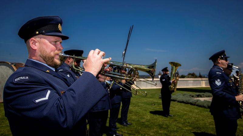 RAAF Musician Leading Aircraftman Michael Fraser plays the trumpet during the Australian National anthem at the Helles Memorial on the Gallipoli Peninsula, Türkiye. Photo: Corporal Madhur Chitnis