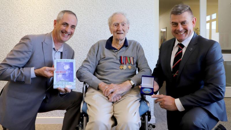 Warrant Officer Class One Benn Goulter, left, and Brigadier Greg Novak, right, with veteran Signalman James ‘Jim’ Easton at the St Heliers Grace Joel Retirement Village, New Zealand. Photo: Maryvonne Gray