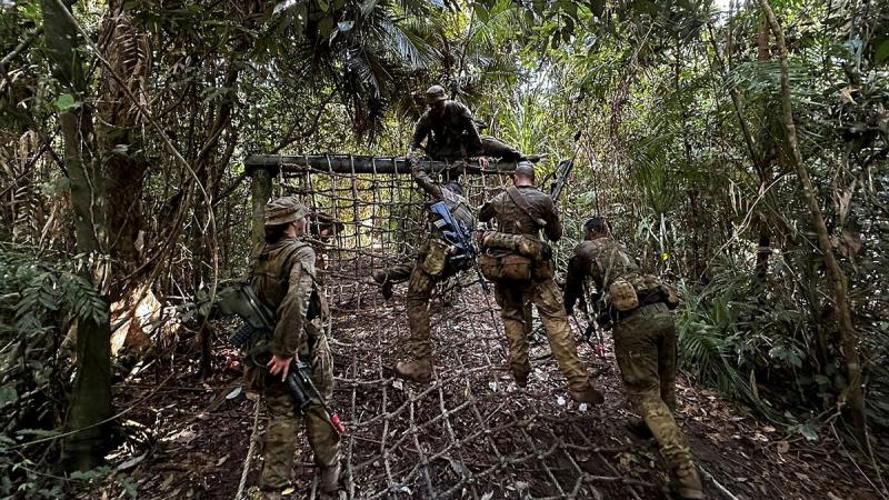 Air defence guards from 2 Security Forces Squadron navigate jungle terrain as part of Exercise Regional War Fighter in Tully Training Area, Queensland. Photos: Flying Officer Sharm Heitmann