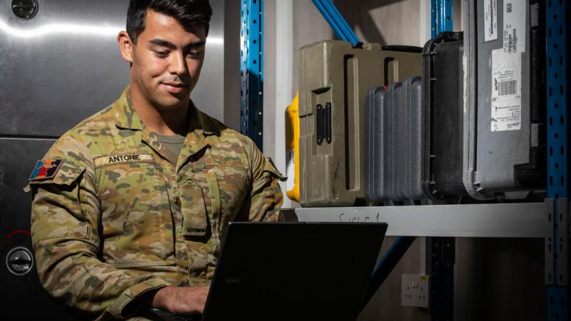 Australian Army Signaller Tyson Antonie is a communication information systems technician deployed on Operation Accordion in the Middle East Region, and is working on upgrading software on IT equipment. Photo: Corporal Melina Young 
