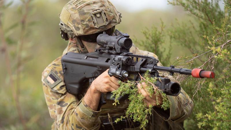 Private Scott Turner, from the 9th Battalion, Royal Queensland Regiment takes up a firing position during a platoon attack on Exercise Robey at the Wide Bay Training Area in Queensland. Photo: Private Connor Morrison