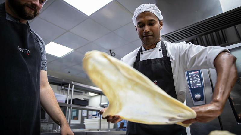 Chef Upali Gurusinghe leads a cooking class for Operation Accordion personnel in the Middle East.