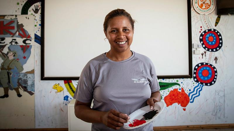 Australian Army Warrant Officer Class Two Anne Dufficy showcasing Indigenous culture with her paintings at South Camp. Photos: Corporal Melina Young
