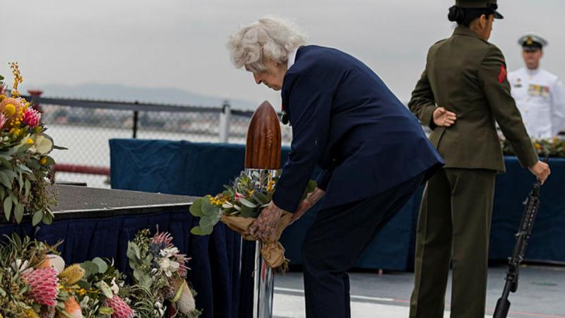 WW2 WAAAF, centenarian Jessie Strike-McClelland lays a tribute to her late husband Billie Strike-McClelland during the Anzac Day service held on board USS Midway in San Siego. Photos: Leading Aircraftwoman Catherine Kelly