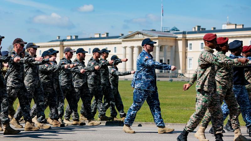 Australia's Federation Guard members march past Old College during a rehearsal for the Coronation of His Majesty The King, at the Royal Military Academy Sandhurst, UK. Photo: Sergeant Andrew Sleeman