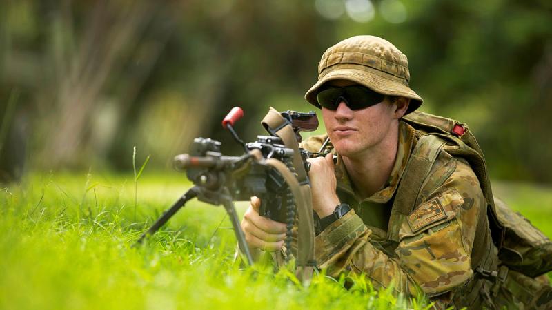 Private Zach Bennie stands guard at an evacuee management centre. Photo: Corporal Dustin Anderson