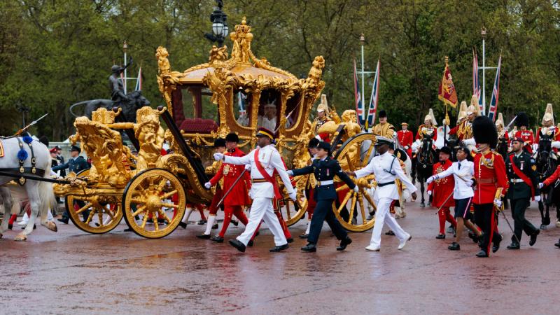 Royal Australian Air Force Corporal Tegan Ross from Australia's Federation Guard with representatives from Commonwealth countries escort the Gold State Coach during the Coronation of His Majesty The King. Photo: Sergeant Andrew Sleeman.