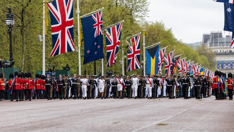Australia's Federation Guard, as part of the Commonwealth contingent, march towards Buckingham Palace during the King's Coronation. Photo: Emma Schwenke.