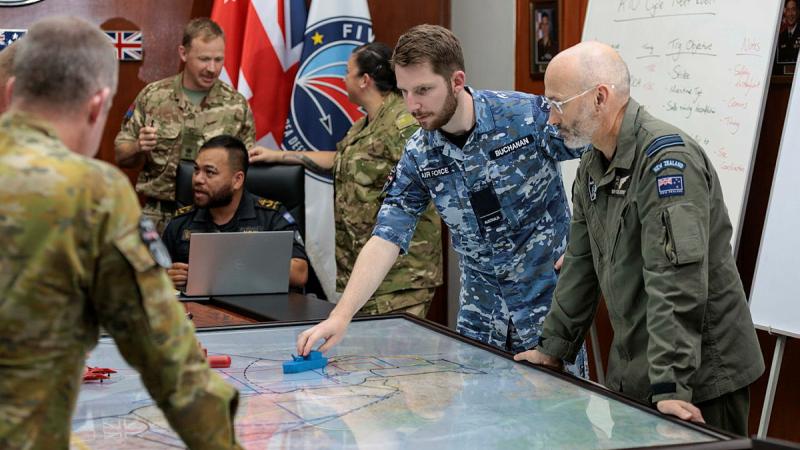RAAF Flying Officer Jake Buchanan discusses training objectives during combined operations planning on Exercise Bersama Shield in Malaysia. Photos: Corporal Lisa Sherman