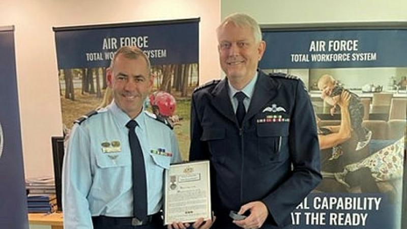  Air Commodore James Badgery – Chief of Staff Air Force HQ, left, presents Wing Commander Glen Krause, right, with his second Federation Star marking 45 years of continuous service in the RAAF.