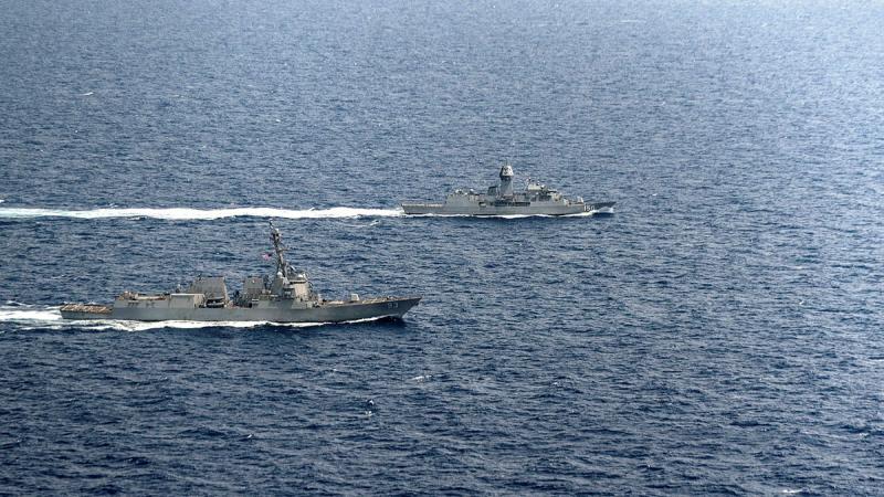 HMAS Anzac (right) sails in company with USS Chung-Hoon through the South China Sea during a regional presence deployment. Photos: Leading Seaman Jarryd Capper