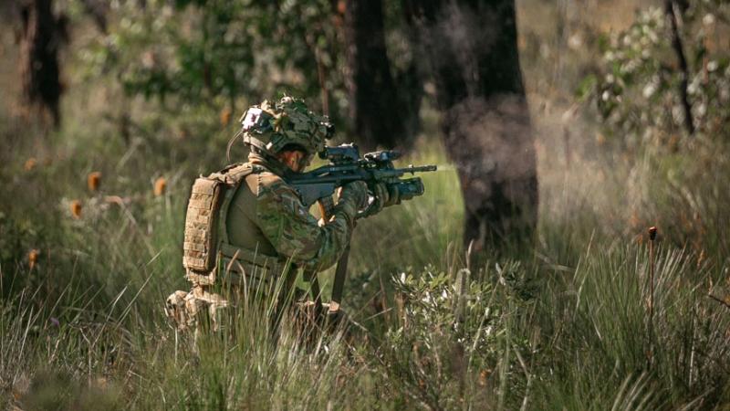 A rifleman from 8th/9th Battalion, The Royal Australian Regiment, engages a target with an EF88 Austeyr rifle during a platoon live-fire training serial a part of Exercise Cobra Run. Photo: Sapper Tristan Montagu