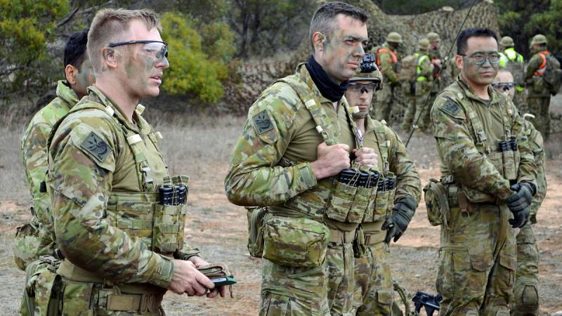 Soldiers with 144 Signals Squadron receive orders as part of Exercise Hermes Recon at the Murray Bridge Training Area, South Australia. Photo: Sergeant Adam Barlow