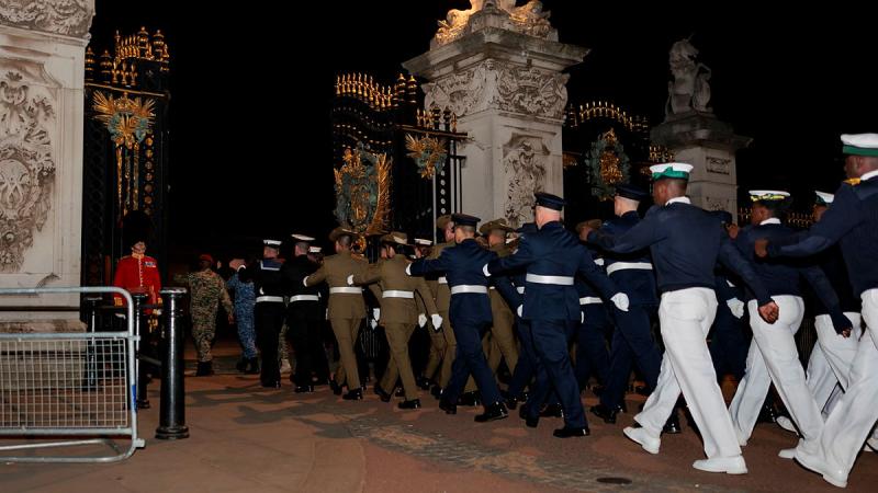 Australia's Federation Guard members march with the Commonwealth contingent into Buckingham Palace gardens during a night rehearsal for the King's Coronation. Photo: Sergeant Andrew Sleeman
