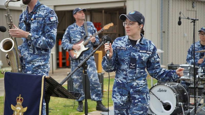 Air Force Rock Band AV8 musician, Leading Aircraftwoman Chloe Bruer-Jones performs during the Soldier on March On Challenge event at RAAF Williams (Laverton) in Victoria. Photos: Sergeant Ralph Whiteoak