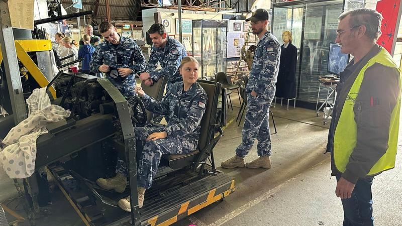 From left, Aircraftman Max Webb, Pilot Officer Toby Olabarriaga, Aircraftwoman Ellie Hawke and orporal Eliott Jones receive a lesson on the cockpit module of the B-24 Liberator from Paul Rourke during a tour of the B-24 Liberator Restoration Museum in Werribee, Victoria. Photos: Flight Lieutenant Brent Moloney