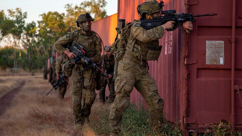 Soldiers from the 5th Battalion, Royal Australian Regiment, 1st Combat Engineer Regiment, the 1st Battalion, Royal Ghurkha Rifles, and Marine Rotational Force - Darwin conduct an urban clearance serial in the Mount Bundey Training Area, NT. Photo: Captain Annie Richardson