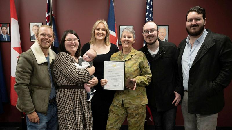 Warrant Officer Class Two Linda Lane (centre) with her family after being presented the Federation Star clasp to her Defence Long Service Medal for 40 years of service at Borneo Barracks in Cabarlah, Queensland. Photo: Warrant Officer Kim Allen