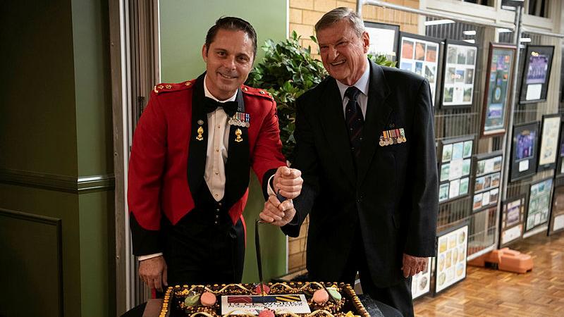 19th Chief Engineer Works (19CED) Commanding Officer Lieutenant Colonel Michael Woods, left, and former Commanding Officer Lieutenant Colonel (retd) John Hopman cut the cake at the 60th anniversary of 19CED at Randwick Barracks in Sydney. Photos: Corporal Lucas Petersen