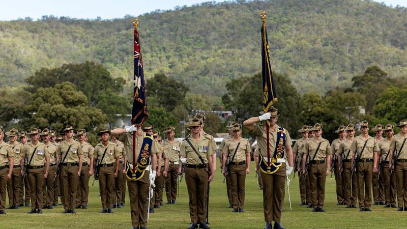 Army soldiers of the 6th Battalion, The Royal Australian Regiment stand to attention during the battalion's King's and Regimental Colours Parade. Photo: Corporal Jacob Joseph