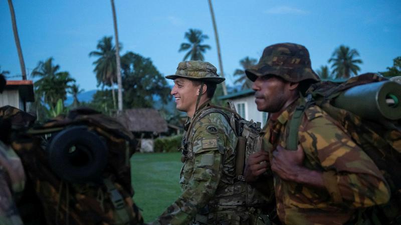 Captain Chris Wetherell pack marches alongside members of the Papua New Guinea Engineer Battalion during a partnership visit in Lae, Papua New Guinea. Photos: Warrant Officer Class Two Neil Ruskin