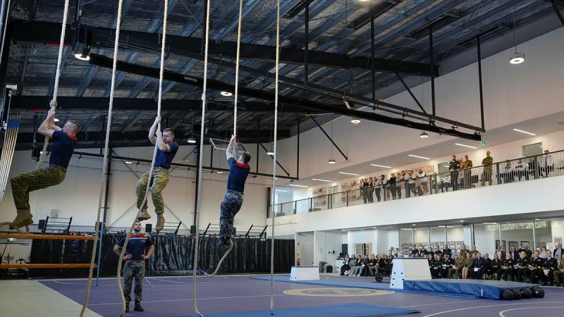 ADF Physical Training Instructors (PTI) demonstrate rope climbing to dignitaries during graduation of and 100th anniversary celebration of Navy PTIs at the ADF Physical Training School at HMAS Cerberus. Photos: Corporal Jacob Joseph