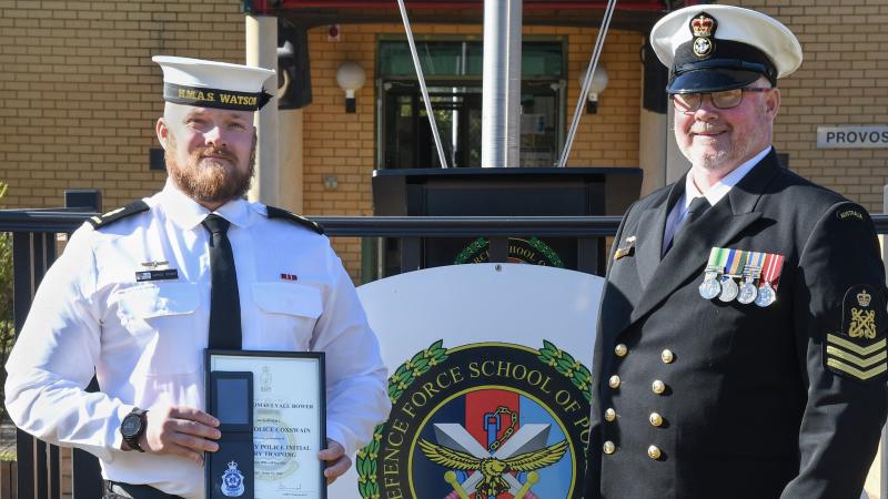 Naval Police Coxswain Able Seaman Thomas Bower with his father Naval Police Coxswain Chief Petty Officer Damien Bower after Thomas' graduation from ADF School of Policing