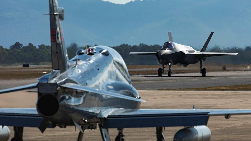 An Air Force Hawk 127 and F-35A Lightning II prepare to take off during Exercise High Sierra at RAAF Base Townsville in Queensland. Photos: LAC Ryan Howell