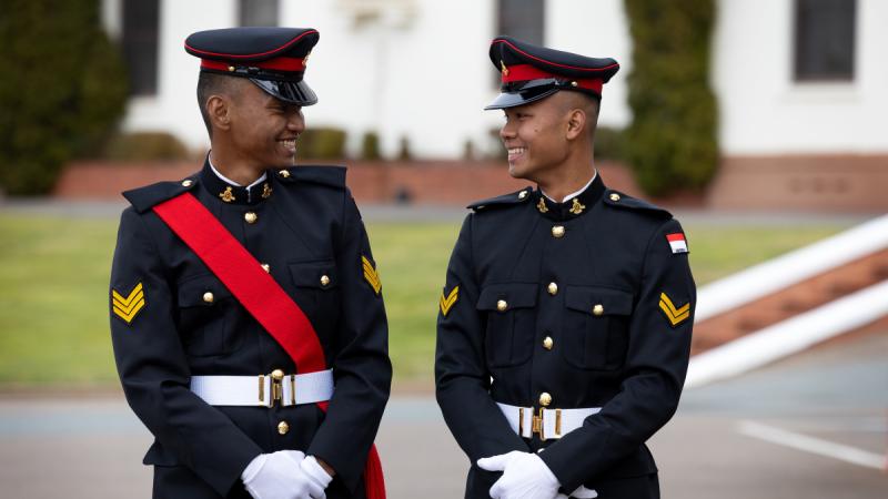 2nd Lieutenants Christopher Bosco Indra Paulo and Tumggul Ageng Prayogi smiling at each other